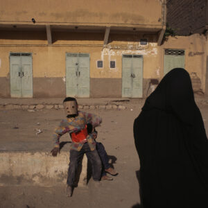 boy wearing mask, erfoud, morocco