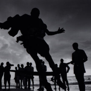 man jumping, stone town beach, zanzibar