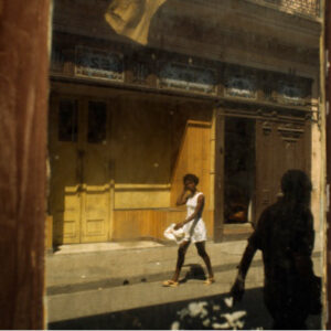 girl seen in mirror, paseo del prado, havana, cuba