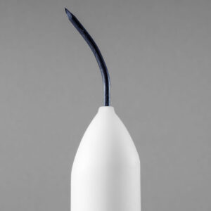 kaars met betonnagel